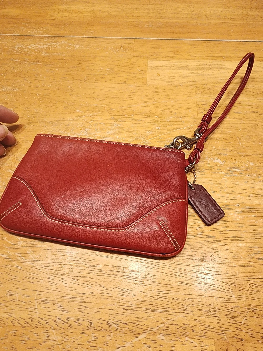 vintage Coach red leather Soho mini wristlet pouch featuring white contrast